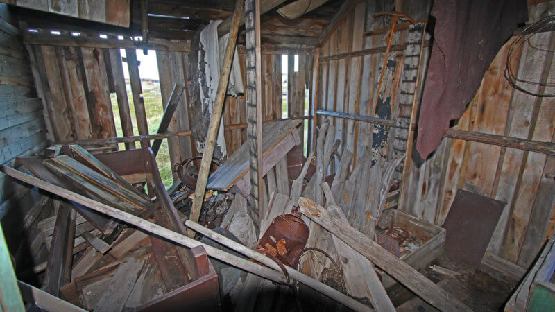 The inside of an old hut filled with disused fishing equipment in Grense Jakobselv.